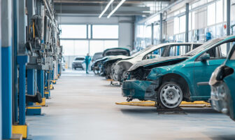 Damged car in a collision shop awaiting repair